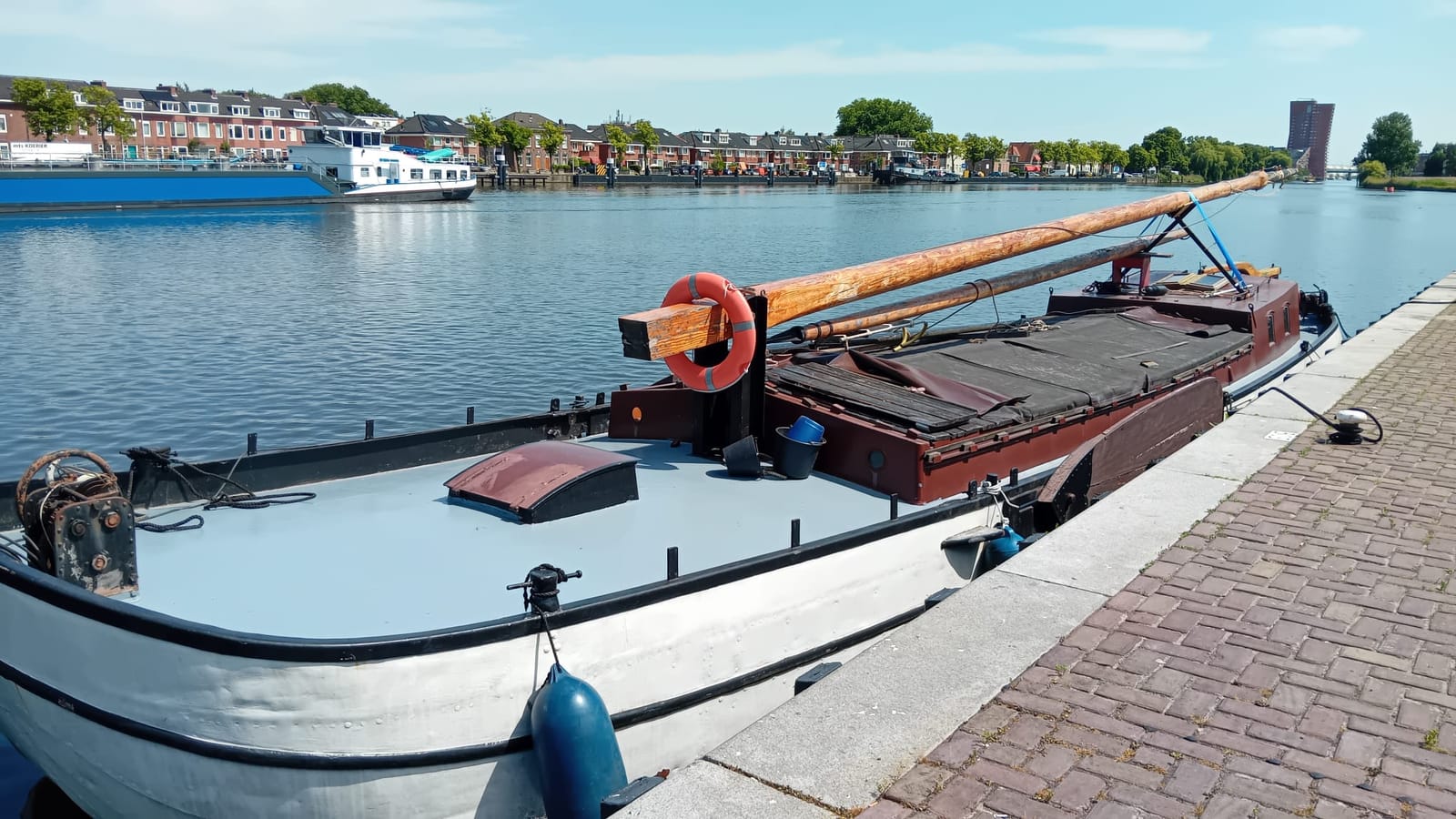 The "Verbetering", a 1916 Hasselter cargo barge, moored on the water